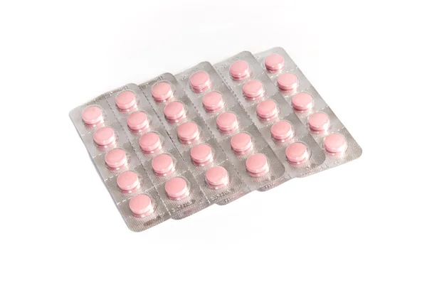 Růžové tablety v balení — Stock fotografie