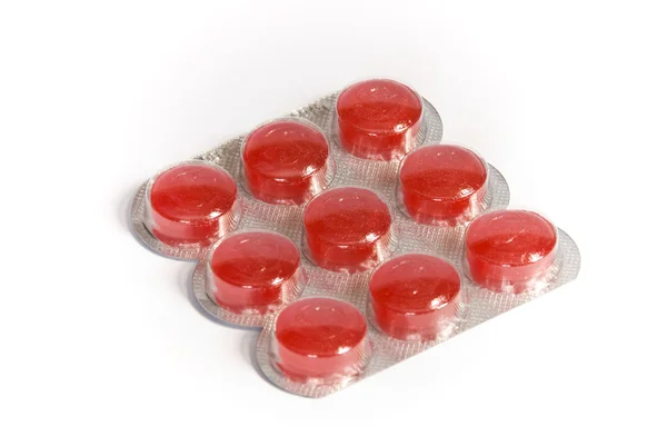 Paketleri içinde kırmızı tabletleri Stok Fotoğraf