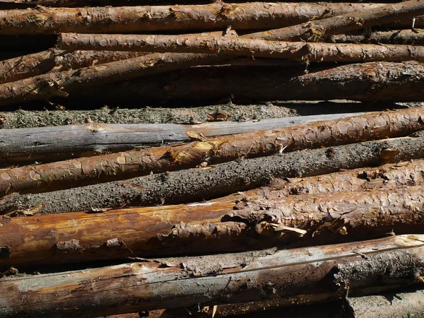 Block av trä på bål som bakgrund — Stockfoto