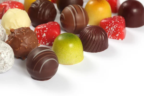 Chocolates surtidos en blanco —  Fotos de Stock