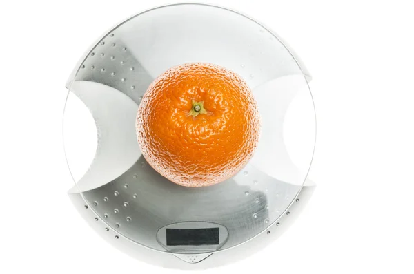 食料規模上のオレンジ色の果物 — ストック写真