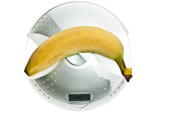 Banana na skali żywności — Zdjęcie stockowe