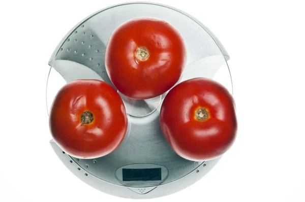 Tomatoes on food scale — Stock Photo, Image