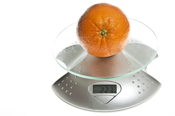 stock image Orange fruit on food scale