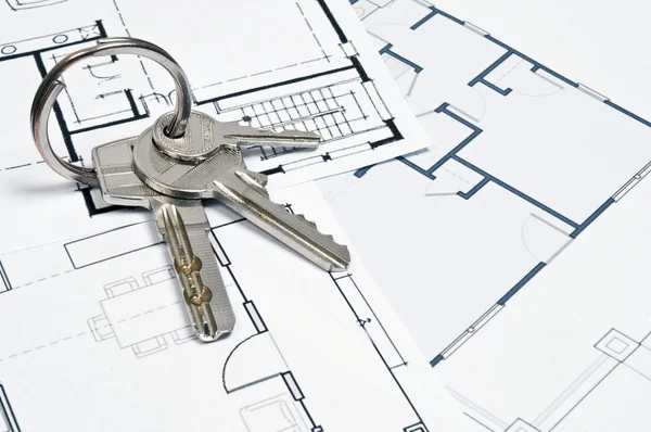 Plany domu i klucz — Zdjęcie stockowe