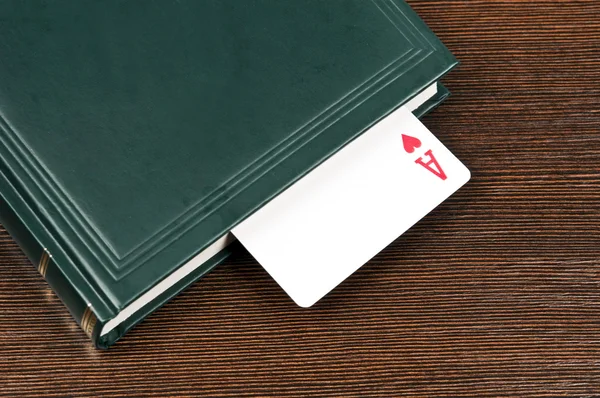 Book and ace card — Stock Photo, Image