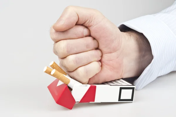 Punch in cigarettes — Stock Photo, Image