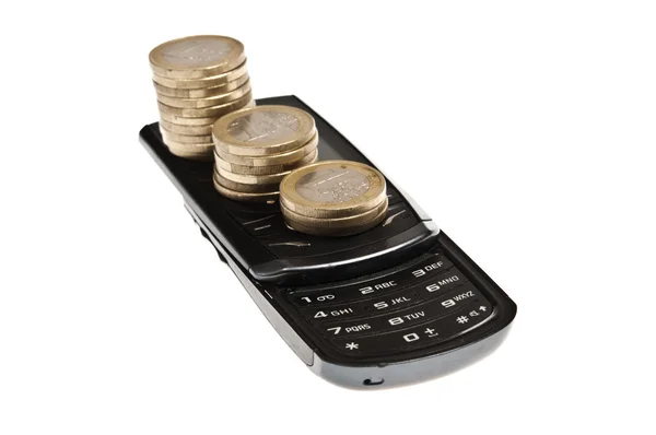 Monedas en el teléfono — Foto de Stock