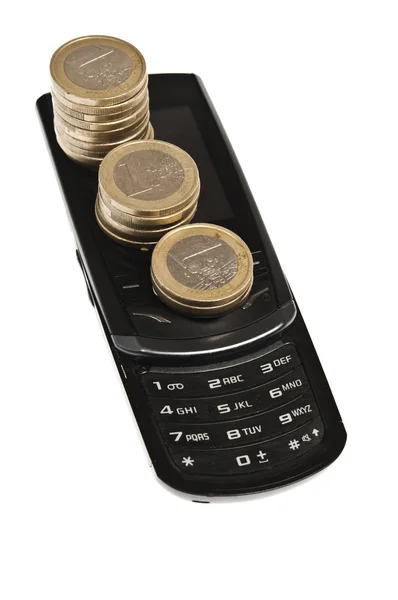 Monedas en el teléfono — Foto de Stock