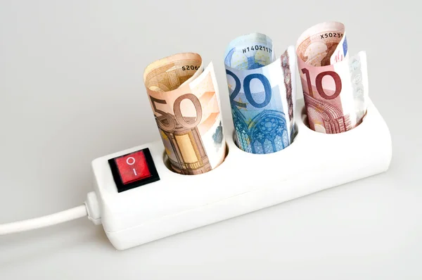 Money on power outlet — Stock Photo, Image