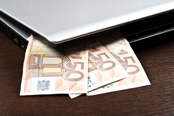 Laptop and money — Stock Photo, Image