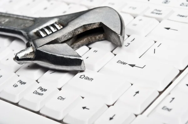 stock image Hand tool on keyboard