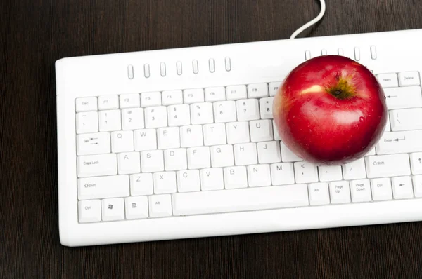 stock image Apple on keyboard