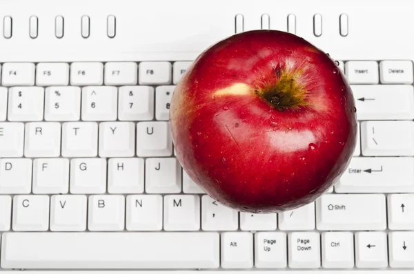 stock image Apple on keyboard