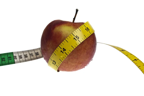 Вимірювальна стрічка і яблуко — стокове фото