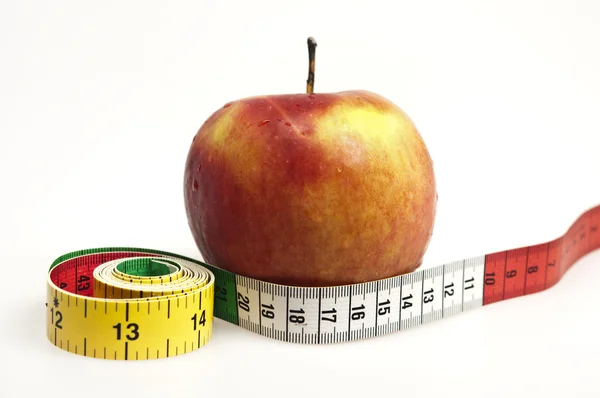 Cinta métrica y manzana —  Fotos de Stock