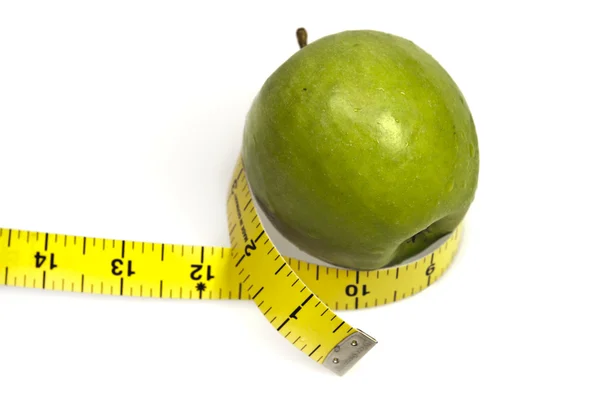 Mätning tejp och äpple — Stockfoto