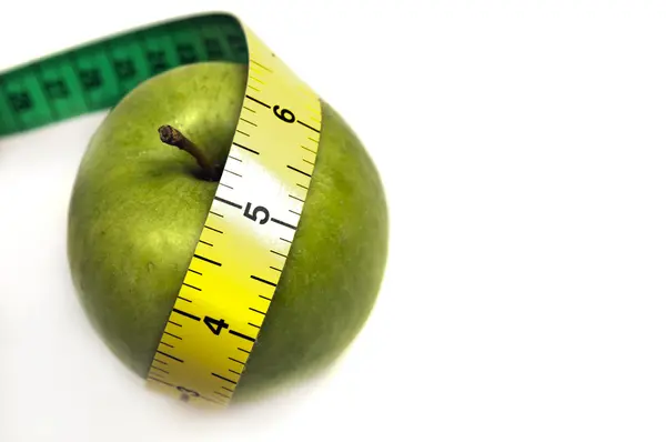 Fita de medição e maçã — Fotografia de Stock