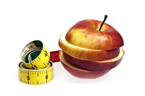 Вимірювальна стрічка і яблуко — стокове фото