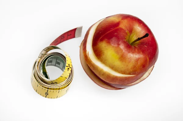Maßband und Apfel — Stockfoto