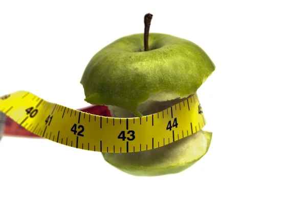 Mätning tejp och äpple — Stockfoto