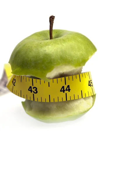 Nastro di misura e mela — Foto Stock