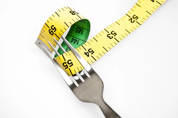 Measurement tape and fork — Stock Photo, Image