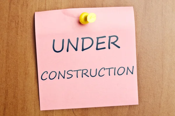 Under construction post it — Stock Photo, Image