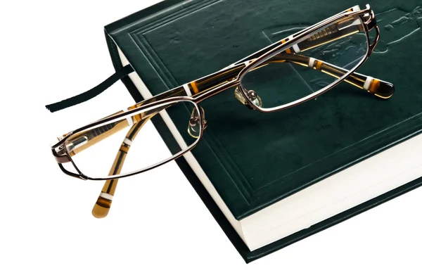 Book and eyeglasses Stock Photo