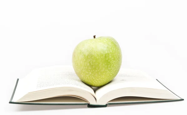 Boek en apple Stockfoto