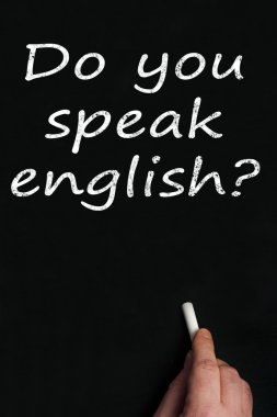 Do you speak english? on black board clipart
