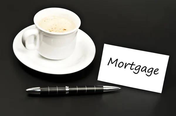 Mortgage message on desk with coffee — Stock Photo, Image
