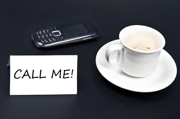 Call me noted on desk with coffee — Stock Photo, Image