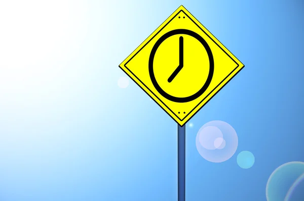 Clock shape on road sign — Stock Photo, Image