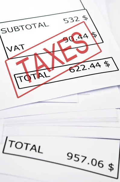 Taxes stamp on financial paper — Stock Photo, Image