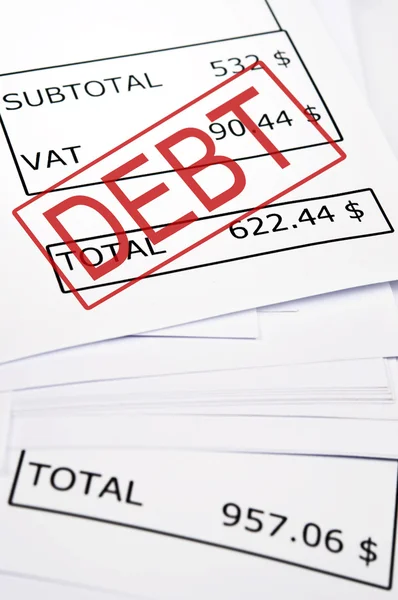 Schuldenmarke auf Finanzpapier — Stockfoto