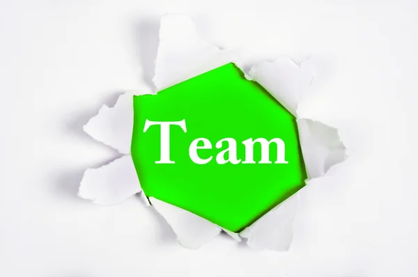 Team under paper — Stock Photo, Image