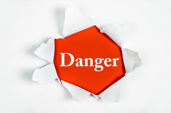 Danger under paper — Stock Photo, Image