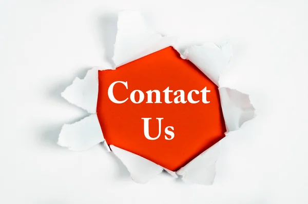 Contact Us under paper — Stock Photo, Image