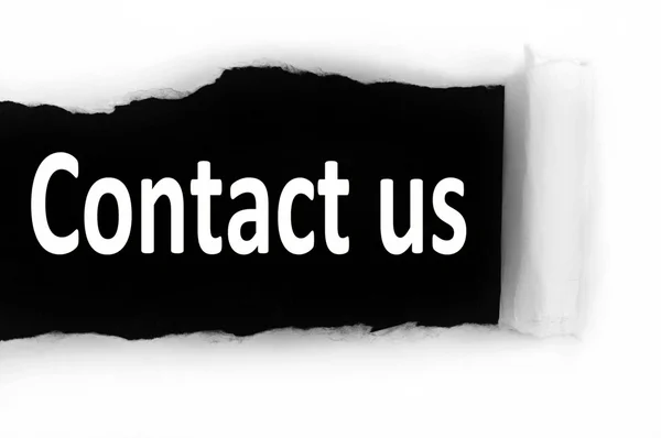 Contact us under paper — Stock Photo, Image