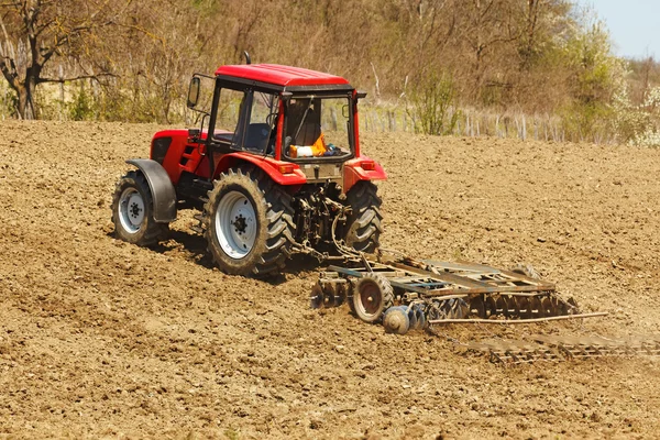 stock image Tractor with disk harrow and rake