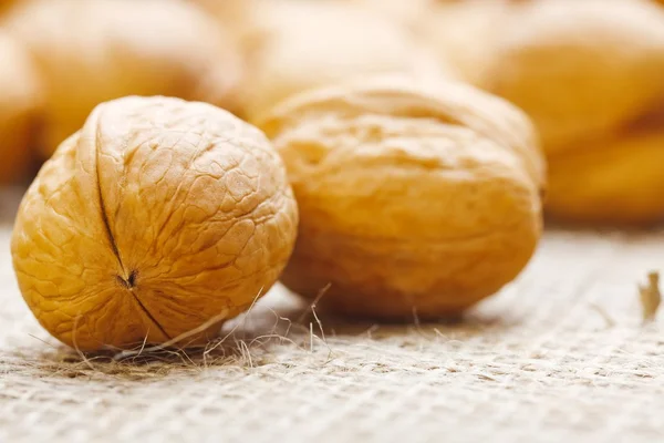 Walnuts on homespun linen background — Stock Photo, Image