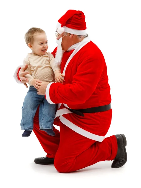 Jultomten och liten pojke tillsammans — Stockfoto