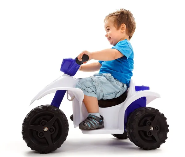 Little boy going fast with quad — Stock Photo, Image