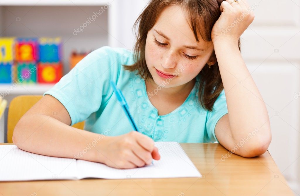Schoolgirl writing boring homework