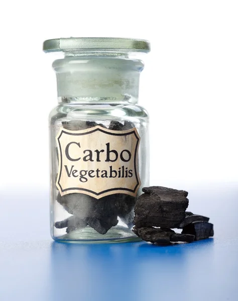 stock image Carbo Vegetabilis, pure carbon in bottle and pieces