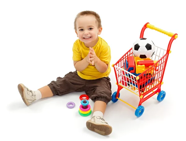 Glad liten pojke, spela med nya leksaker — Stockfoto