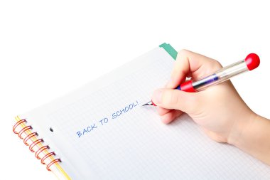 Child's hand writing words 