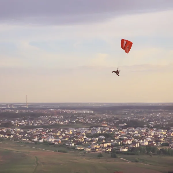 Paragliding over small suburban houses