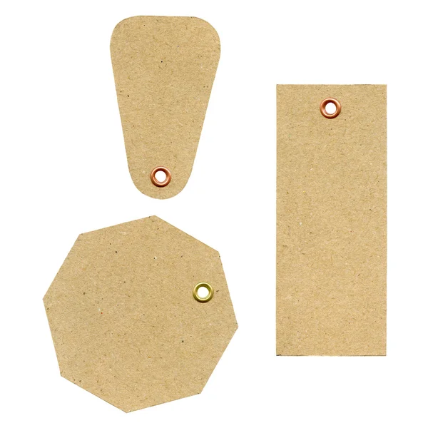 Un conjunto de tres nuevas etiquetas de papel rugoso marrón en blanco — Foto de Stock